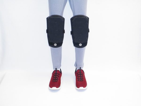 Model in red shoes wearing a pair of K2S-250 Knee Pads with fixed rubber wear pads